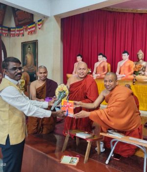 Honouring the then Karnataka Sanskrit University Registrar Dr. Kotresh.